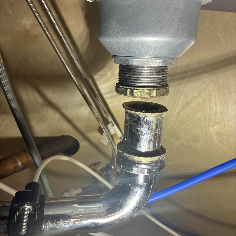 Kitchen sink tailpiece and slip-joint nut disconnect close-up