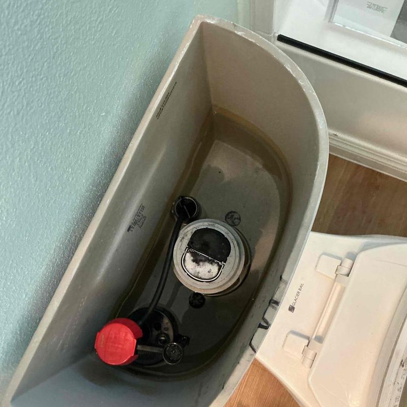 Toilet fill valve inside tank with water level