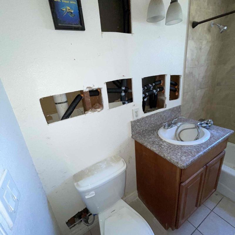 PEX water piping replacement inside bathroom wall cavity