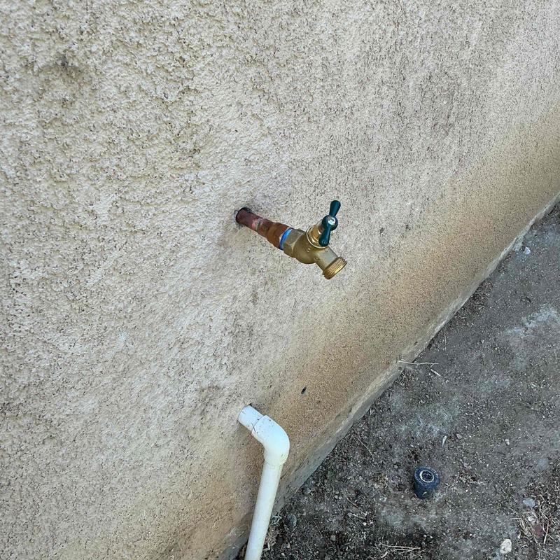 Threaded copper adapter and hose bib on exterior wall