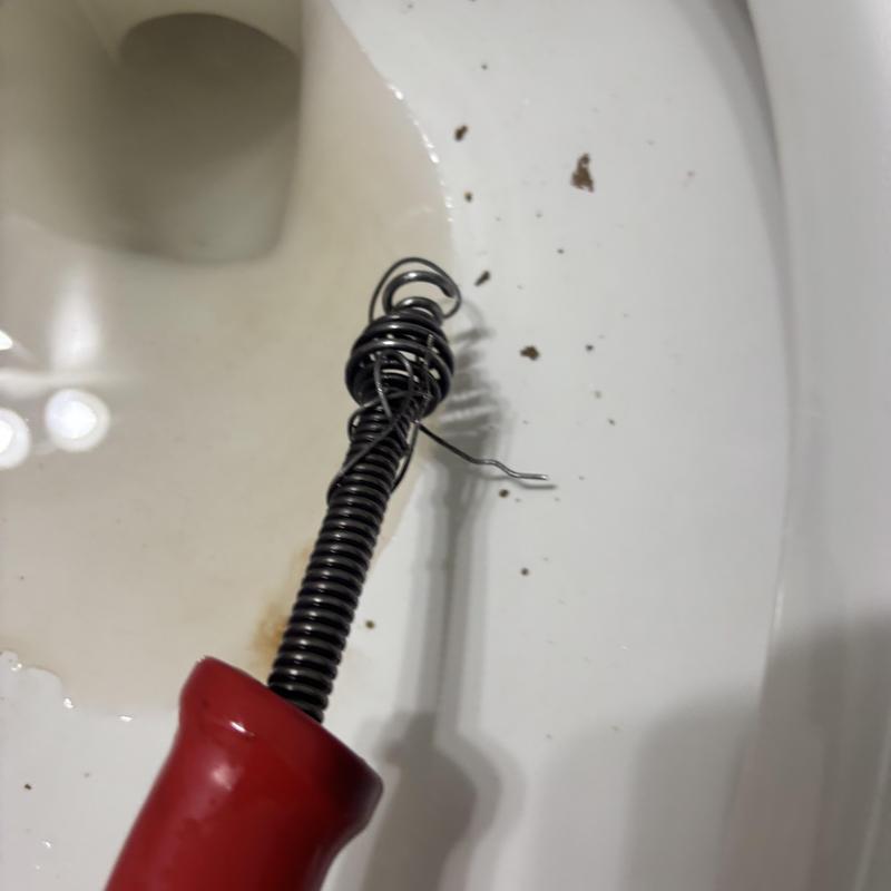 Toilet obstruction wire removal tool inside toilet bowl Toilet obstruction wire removal tool inside toilet bowl