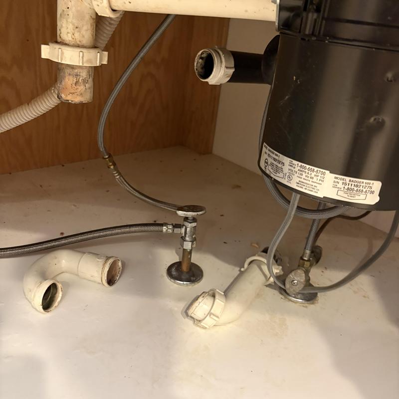 Kitchen drain pipe and garbage disposal under sink Kitchen drain pipe and garbage disposal under sink