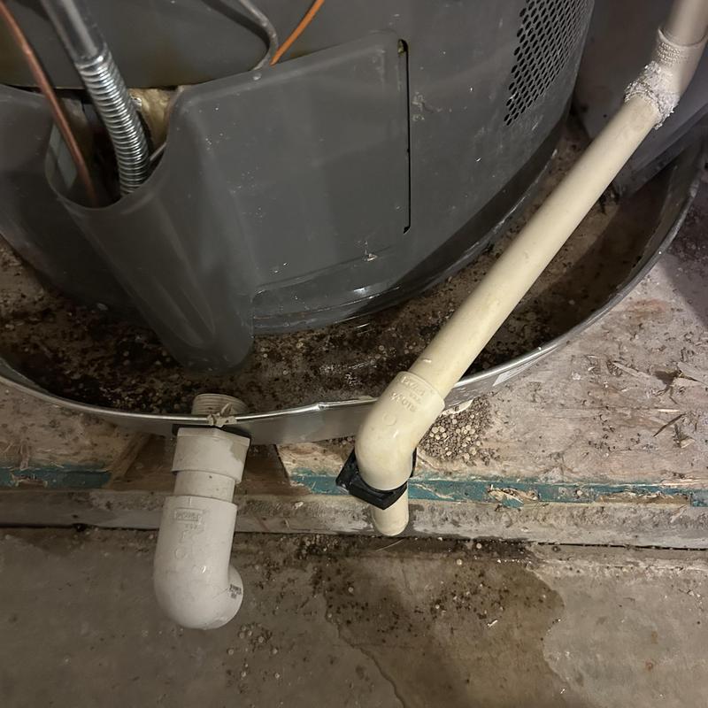 Water heater drain pipe and leak inspection in basement Water heater drain pipe and leak inspection in basement