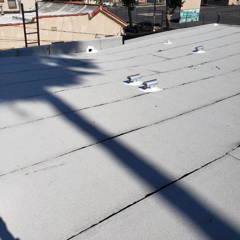 Flat roof membrane with ventilation pipes and seams Flat roof membrane with ventilation pipes and seams