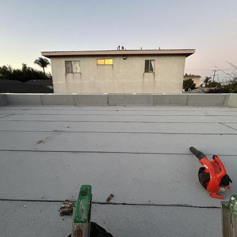 Flat roof surface with blower and ladder tools Flat roof surface with blower and ladder tools