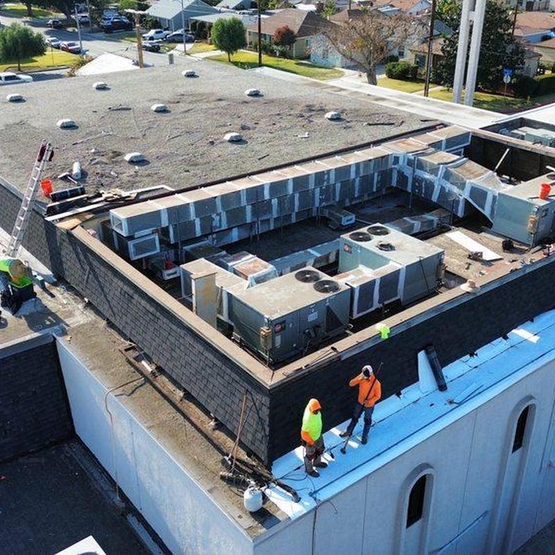 Commercial rooftop HVAC units with technician inspection Commercial rooftop HVAC units with technician inspection