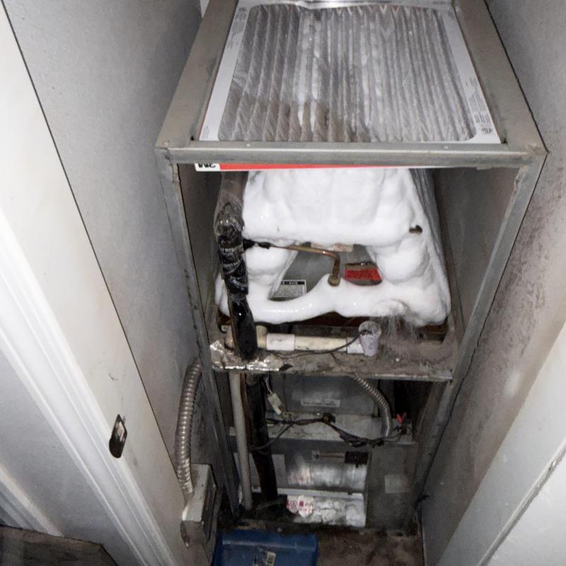 Indoor evaporator coil frozen over in HVAC system Indoor evaporator coil frozen over in HVAC system