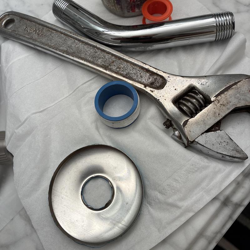 Shower arm installation parts and adjustable wrench Shower arm installation parts and adjustable wrench