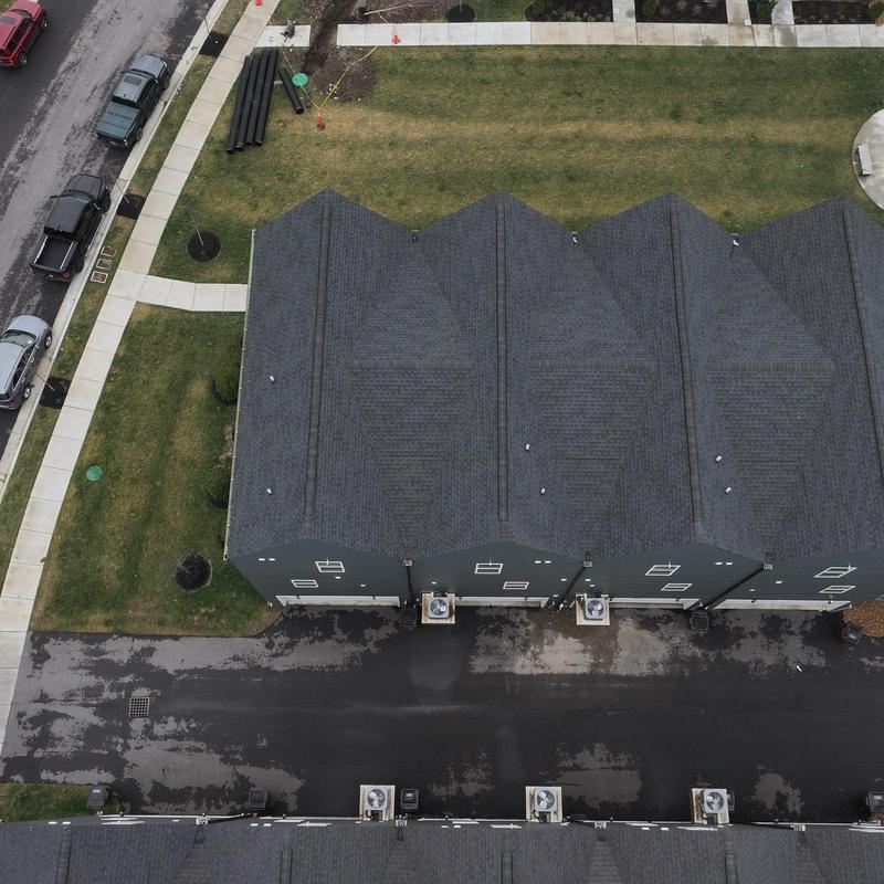 Asphalt shingle roof inspection on multi-unit building