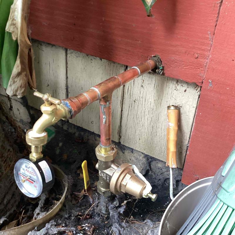 Water pressure regulator with gauge and copper piping
