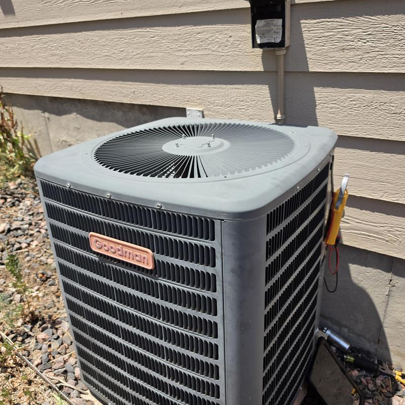 Goodman air conditioner unit with voltage capacitor test clamp