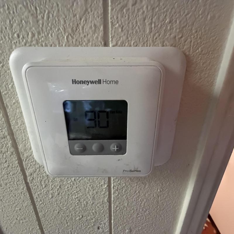 Thermostat display showing temperature setting Thermostat display showing temperature setting