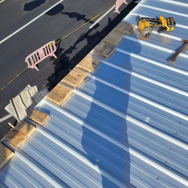 Metal roof panel with wood blocks and tools Metal roof panel with wood blocks and tools