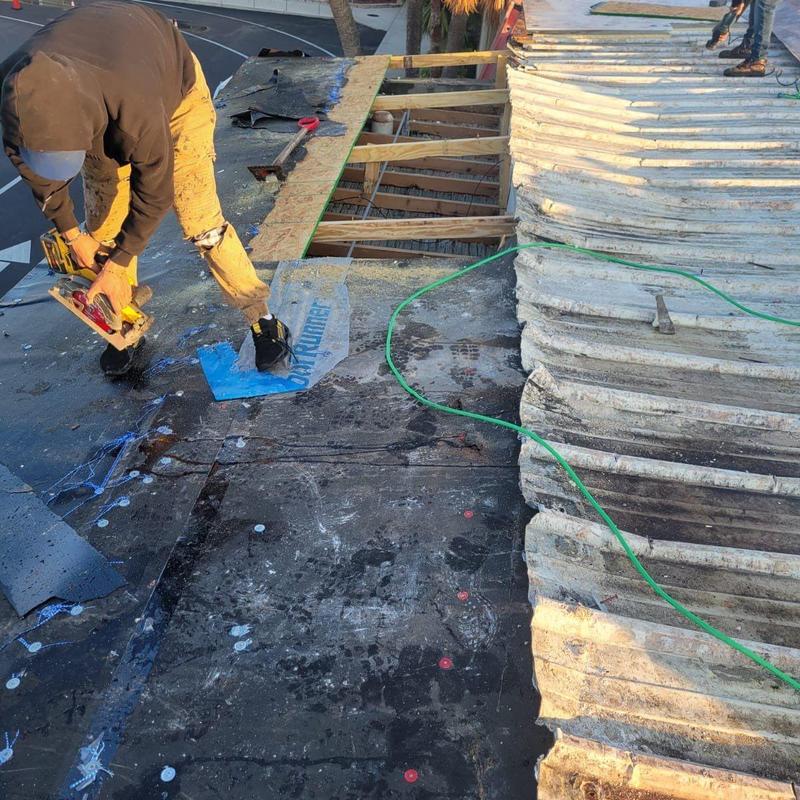 Flat roof decking removal near corrugated metal panels Flat roof decking removal near corrugated metal panels