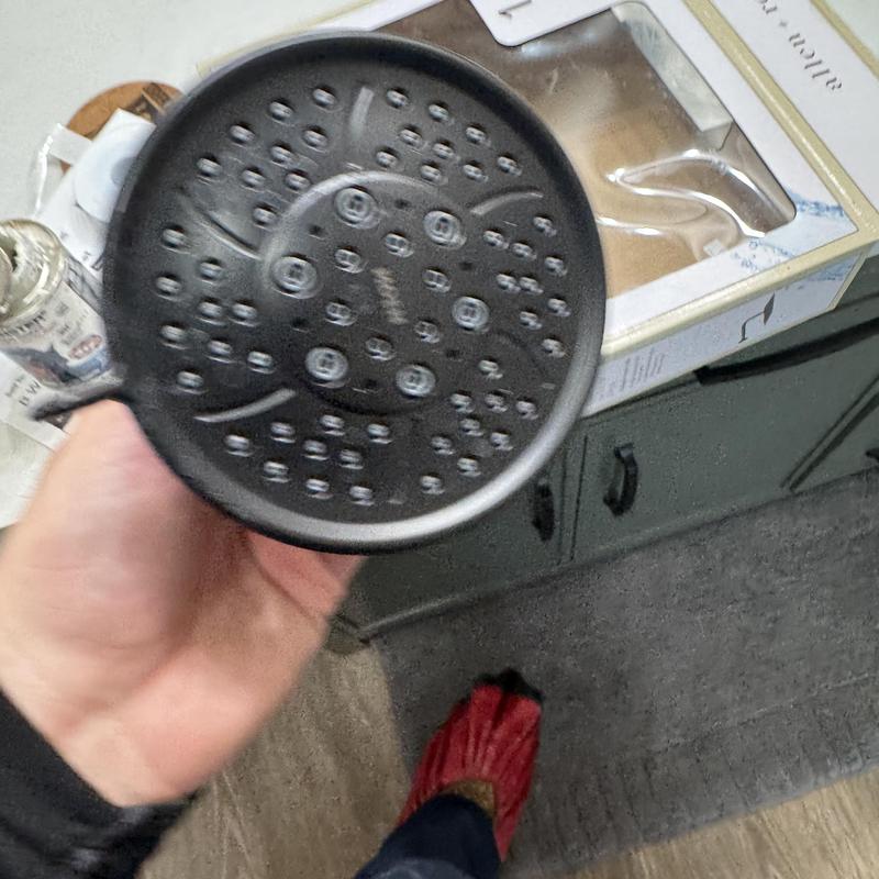 Rain shower head held over bathroom cabinet and floor Rain shower head held over bathroom cabinet and floor