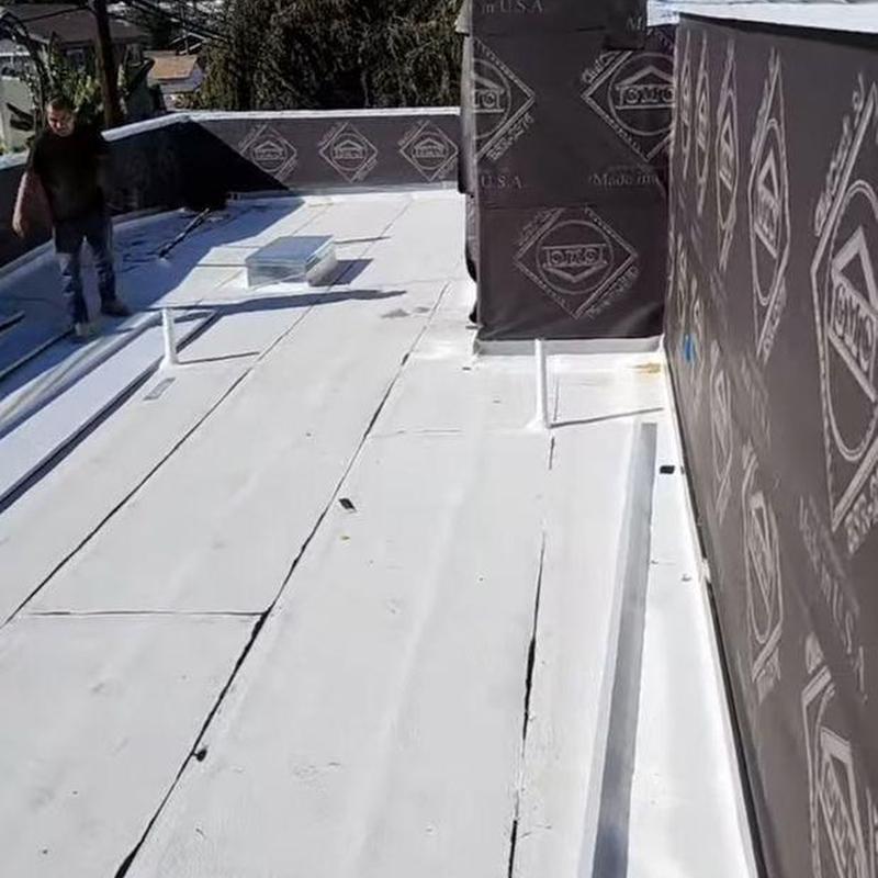 Flat roof membrane inspection with roofing technician Flat roof membrane inspection with roofing technician