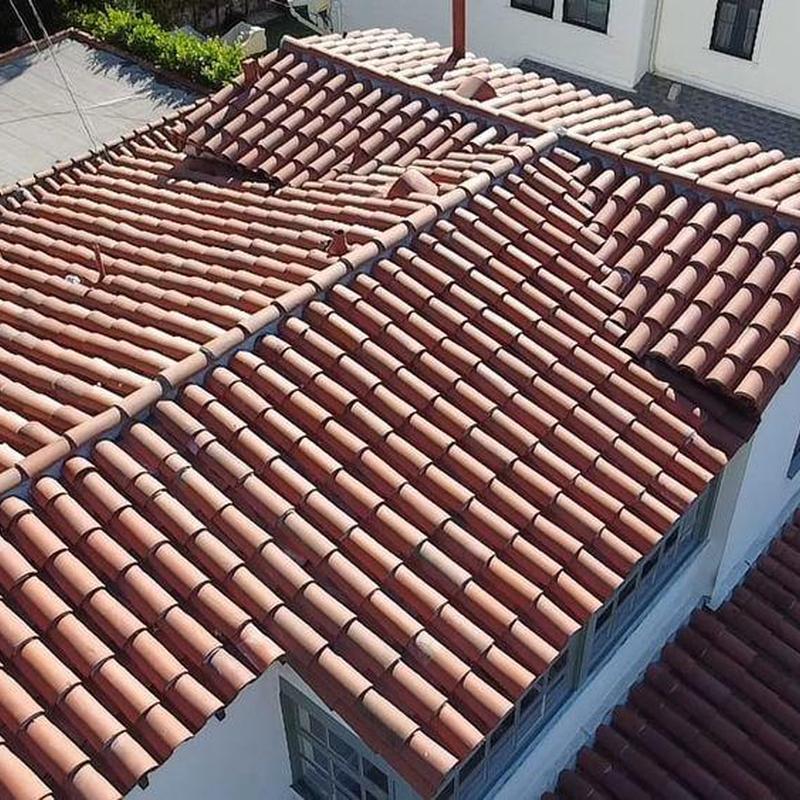 Tile roof with ridge and hip tiles in good condition Tile roof with ridge and hip tiles in good condition