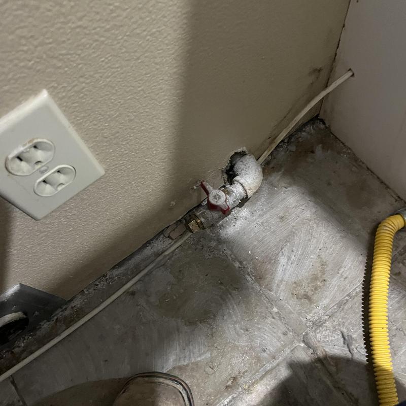 Gas line valve with sealed countertop removed in corner Gas line valve with sealed countertop removed in corner