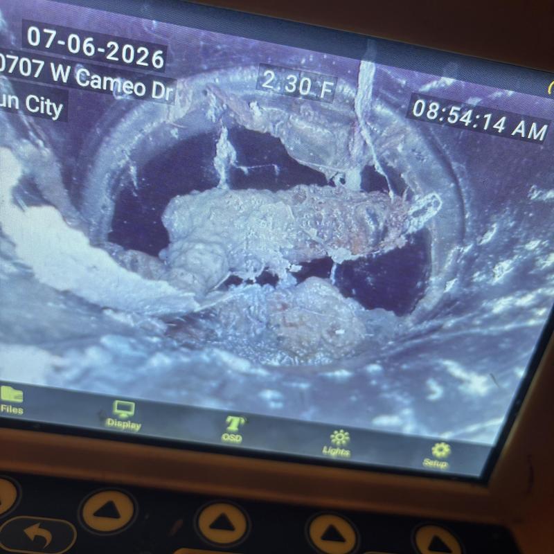 Drain line pipe interior inspection showing buildup