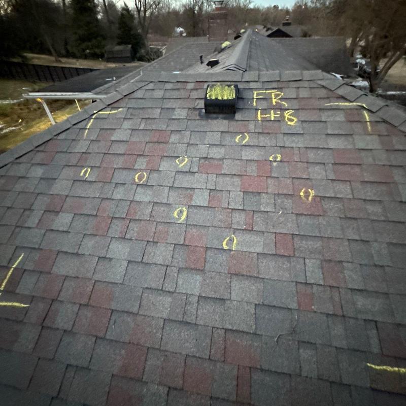 Asphalt shingle roof with hail damage inspection markings