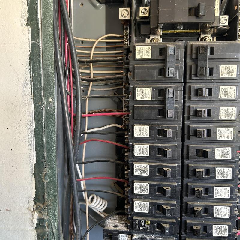 Electrical breaker panel with circuit breakers and wiring