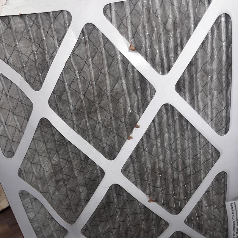HVAC air filter with visible dirt buildup