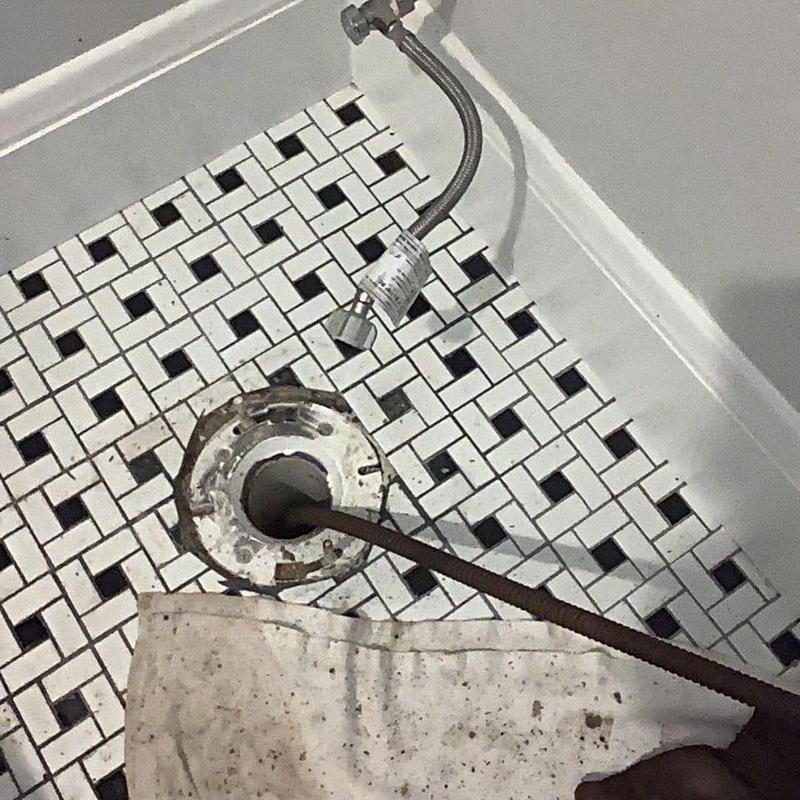 Toilet flange with clearing snake and water supply line Toilet flange with clearing snake and water supply line