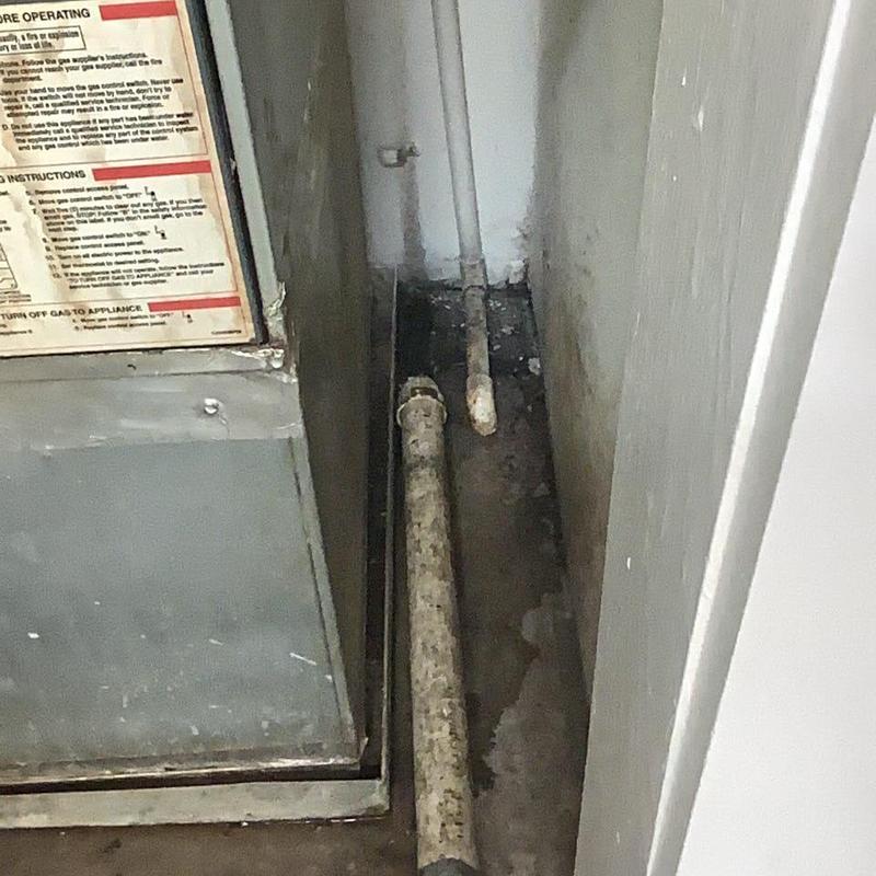 Condensation drain pipes next to furnace unit Condensation drain pipes next to furnace unit