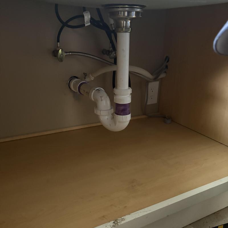 Kitchen sink drain pipe with power snaking access