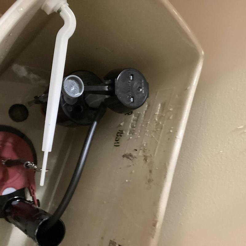 Fill valve and flapper assembly inside toilet tank Fill valve and flapper assembly inside toilet tank