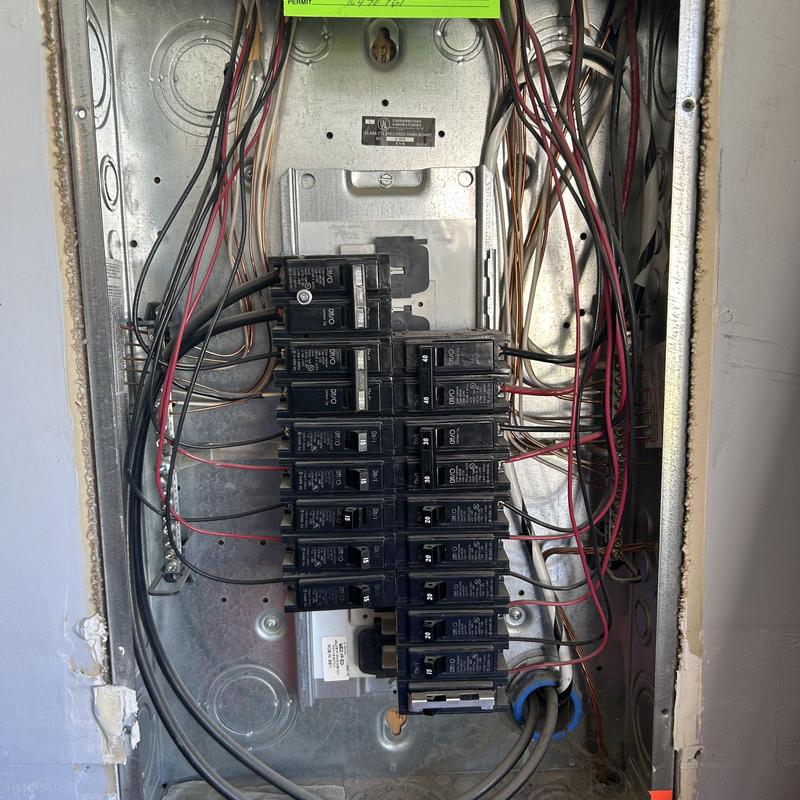 Electrical breaker panel with circuit breakers and wiring