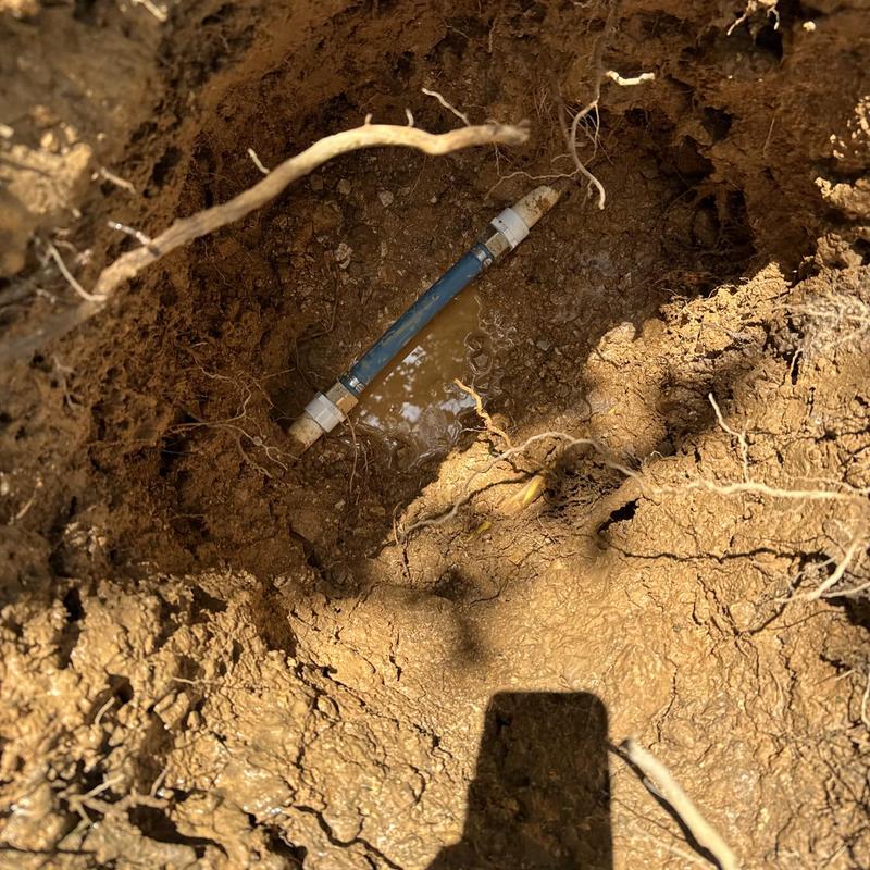 Water line with PEX piping in ground trench Water line with PEX piping in ground trench