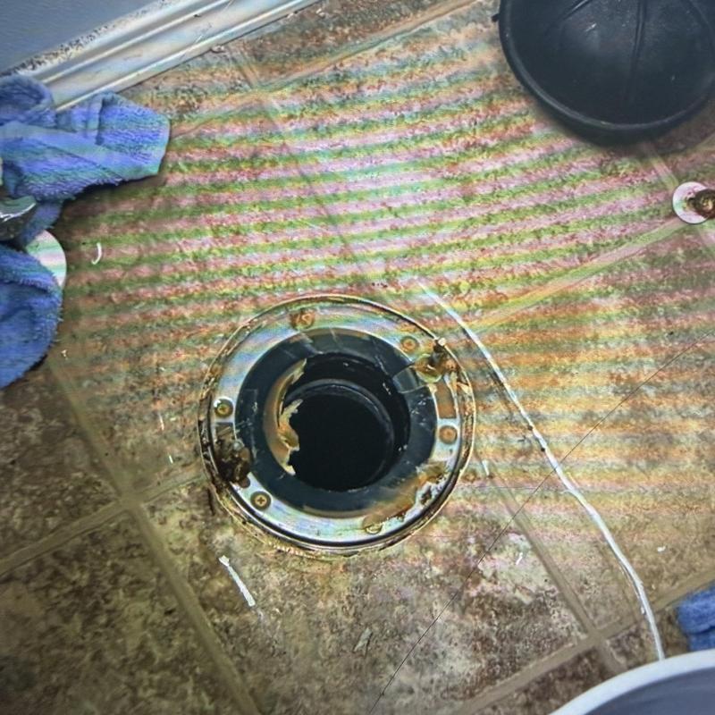 Toilet flange and drain pipe on tiled floor installation Toilet flange and drain pipe on tiled floor installation