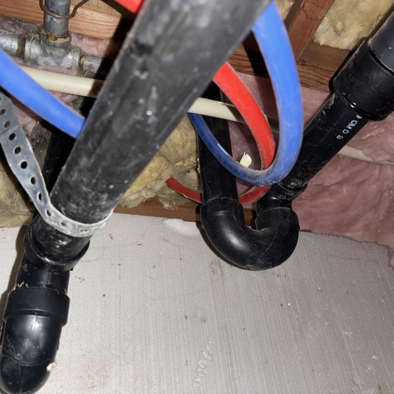 Shower valve and drain piping under floor joist Shower valve and drain piping under floor joist