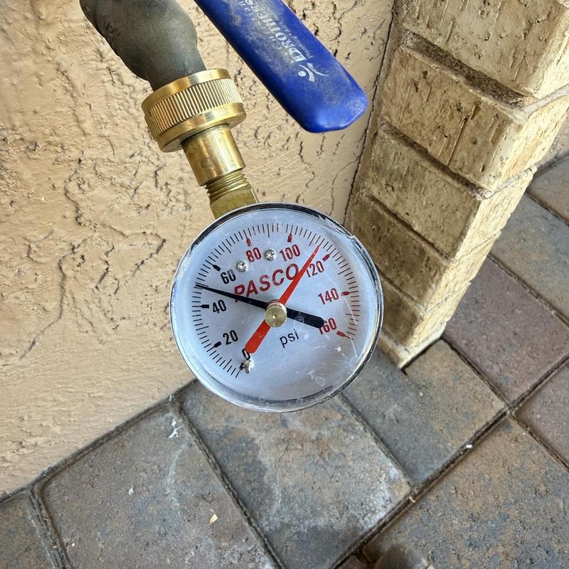 Water pressure gauge on outdoor hose valve