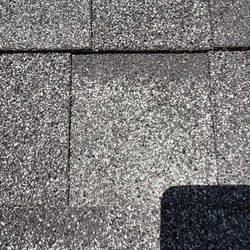 Asphalt shingle roof with severe granule loss