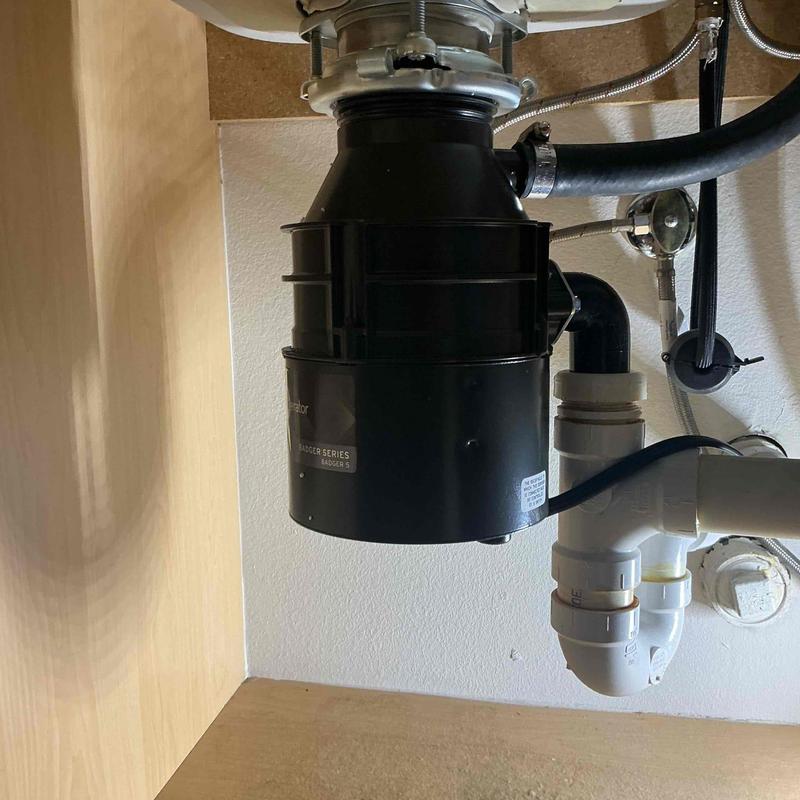 Garbage disposal with new gaskets and tailpiece