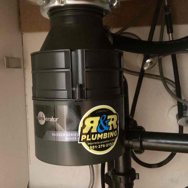 Garbage disposal unit installation under kitchen sink