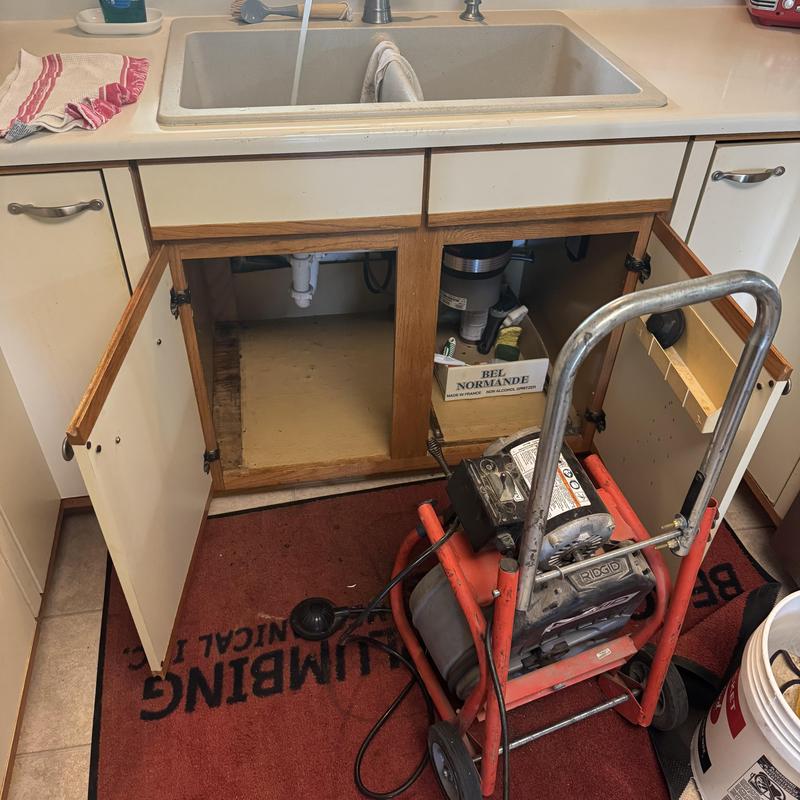 Kitchen sink drain line with plumbing snake machine Kitchen sink drain line with plumbing snake machine