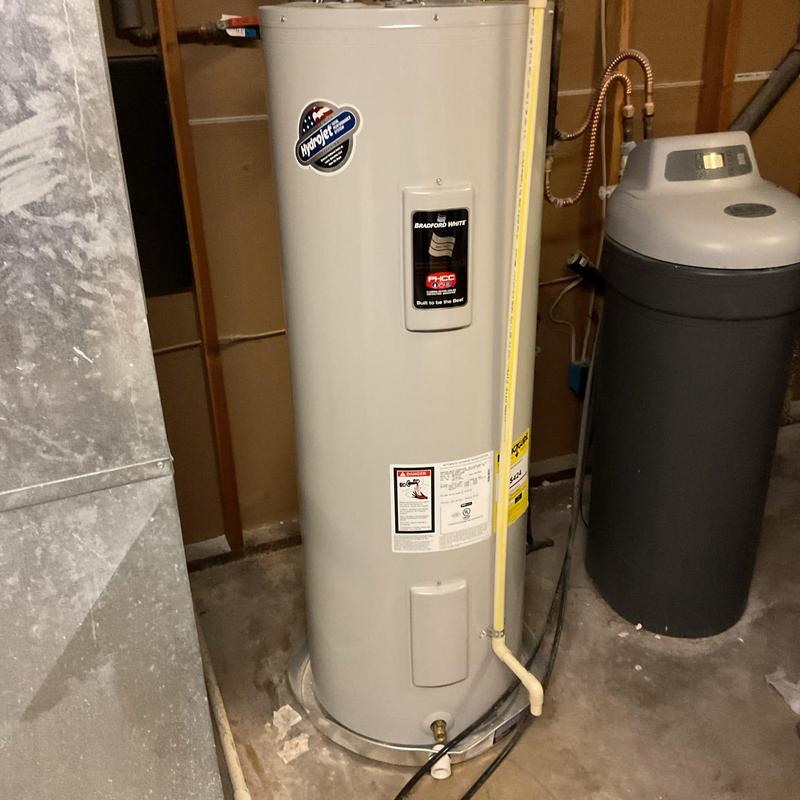 Electric water heater and water softener in basement Electric water heater and water softener in basement