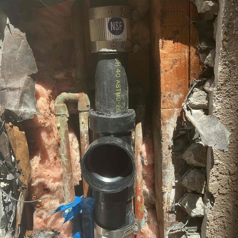 1-1/2-inch ABS sanitary tee and pipe section installation