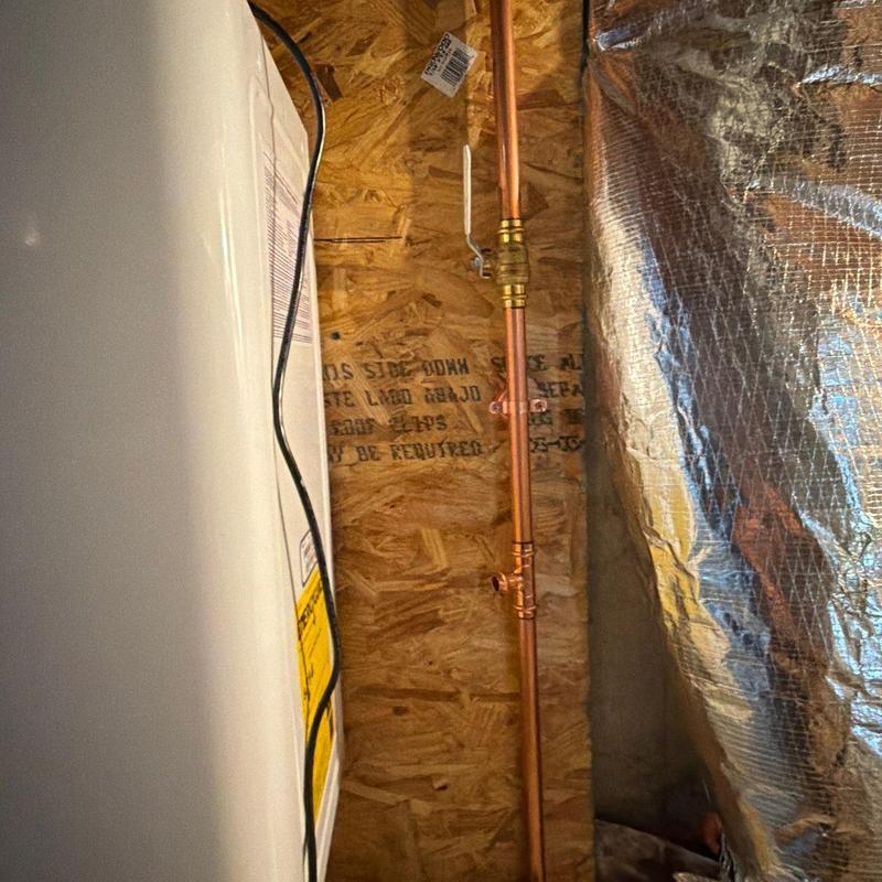 Copper pipe installation with shutoff valve near water heater