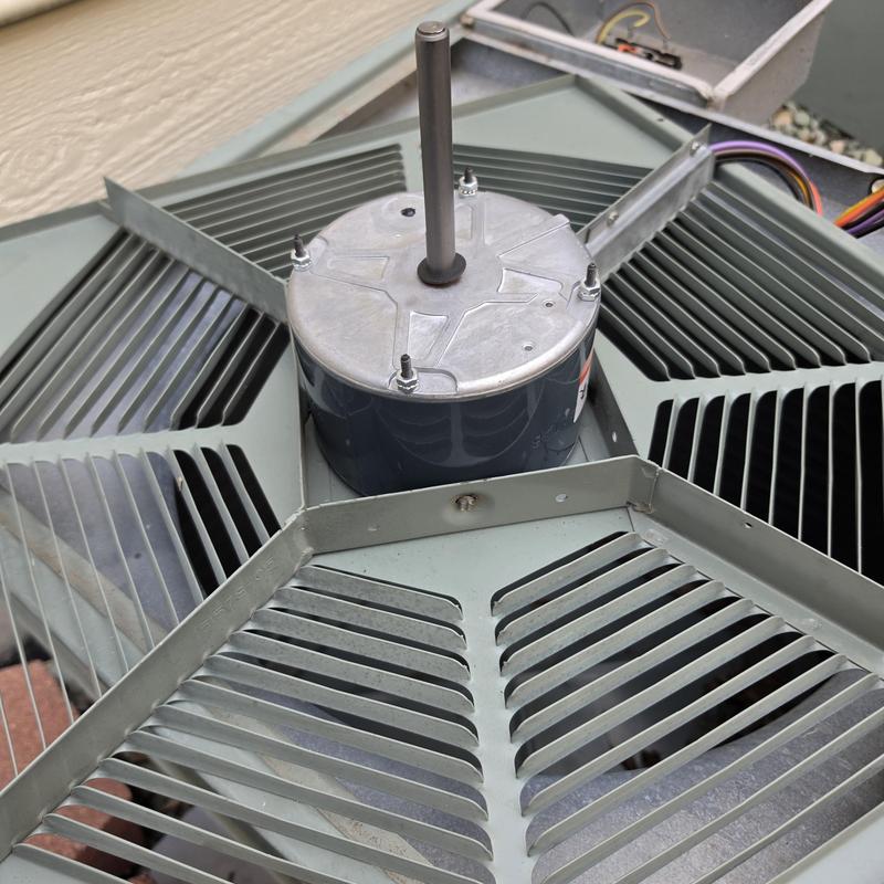 Condenser fan motor on Rheem air conditioner unit