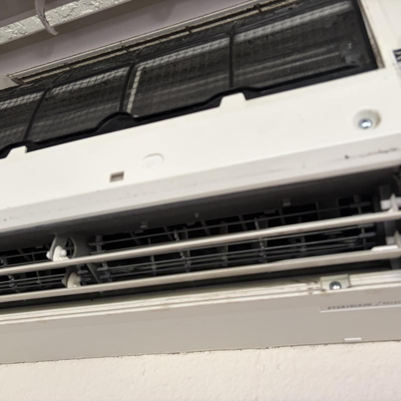 Mini-split indoor air handler with visible dirt buildup Mini-split indoor air handler with visible dirt buildup