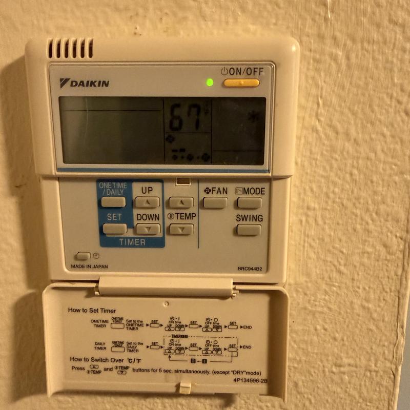 Daikin mini-split thermostat control panel on wall Daikin mini-split thermostat control panel on wall
