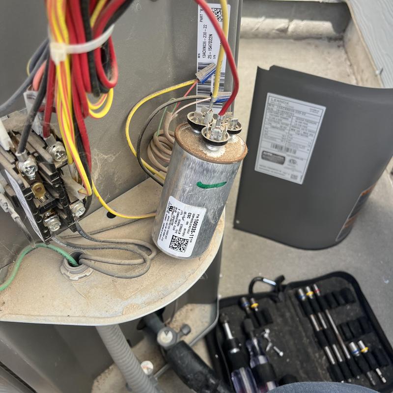 Dual run capacitor and HVAC wiring inside condenser unit