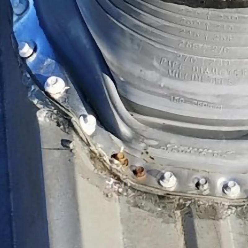 Roof pipe flashing with rusted and damaged bolts