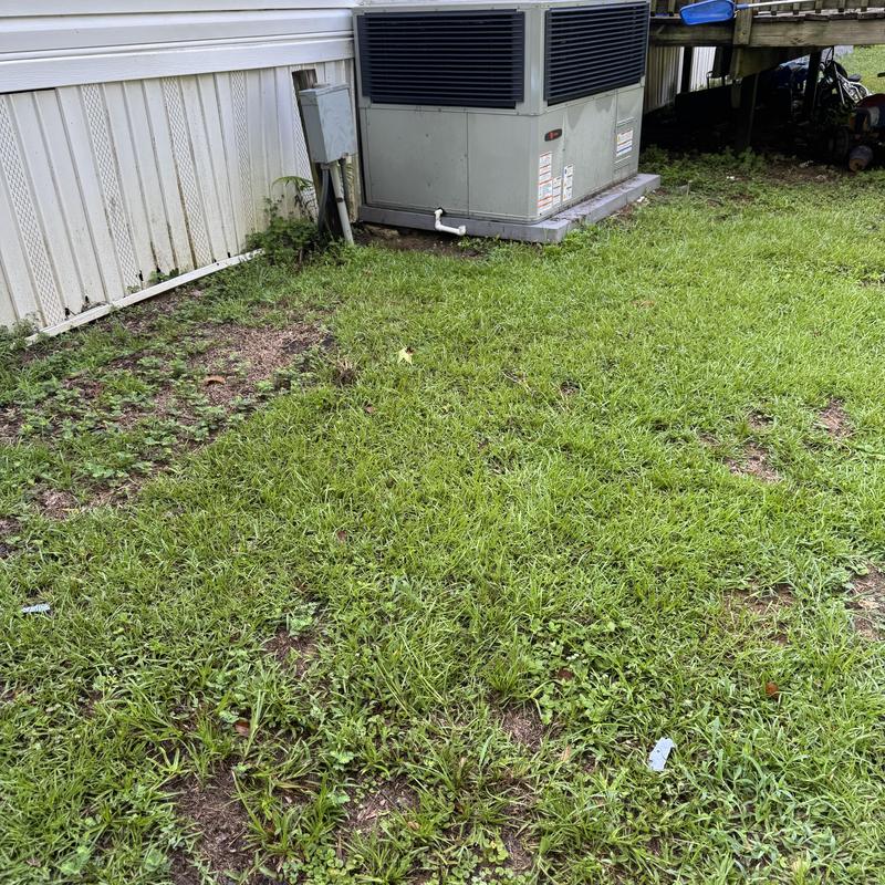 Package unit HVAC system inspection near house exterior
