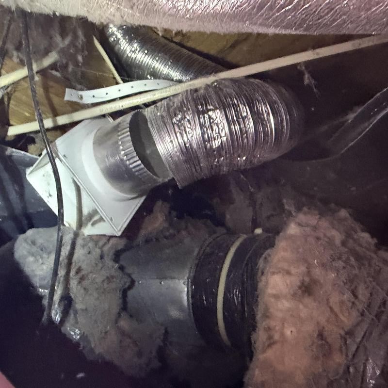 Dryer vent duct in crawlspace with lint buildup Dryer vent duct in crawlspace with lint buildup