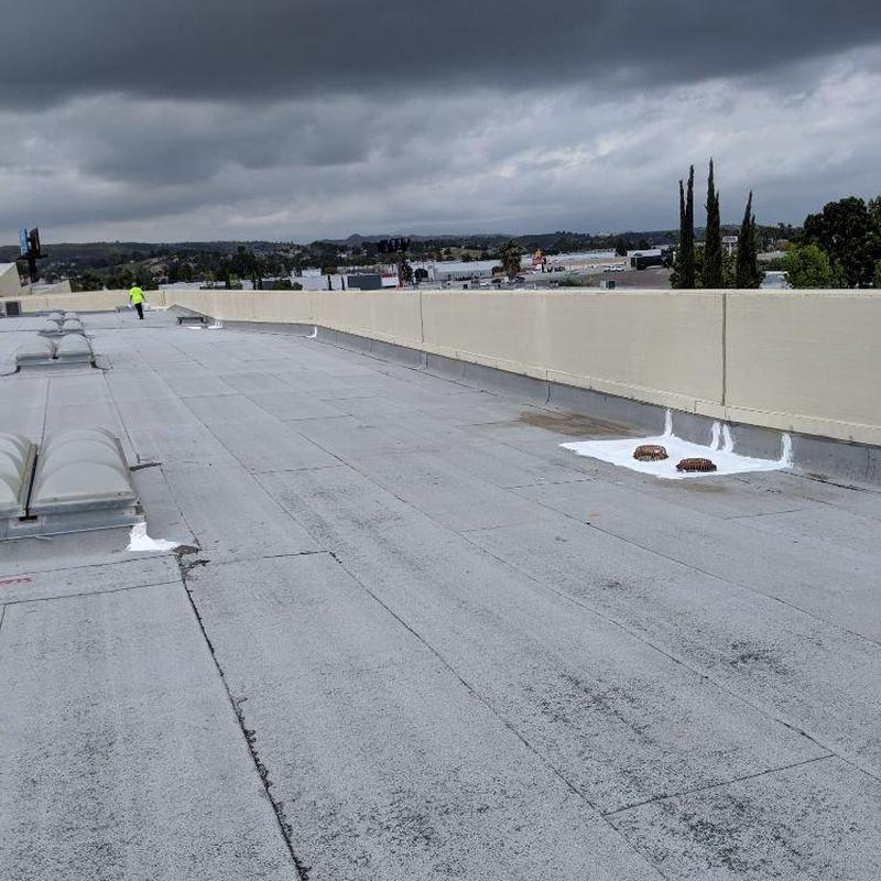 Flat roof with ventilation pipe seals and inspection view Flat roof with ventilation pipe seals and inspection view